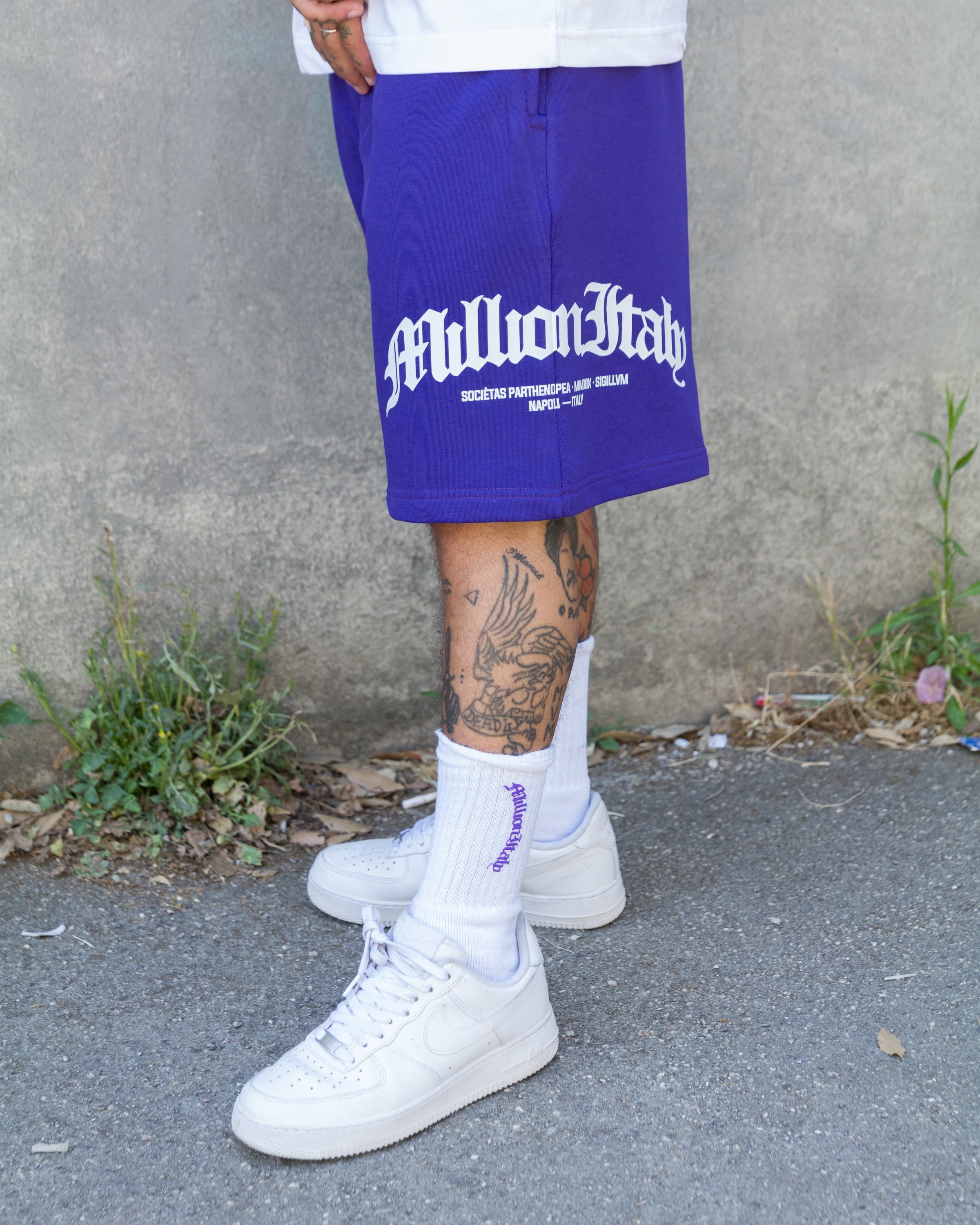 Shorts violet à logo arqué