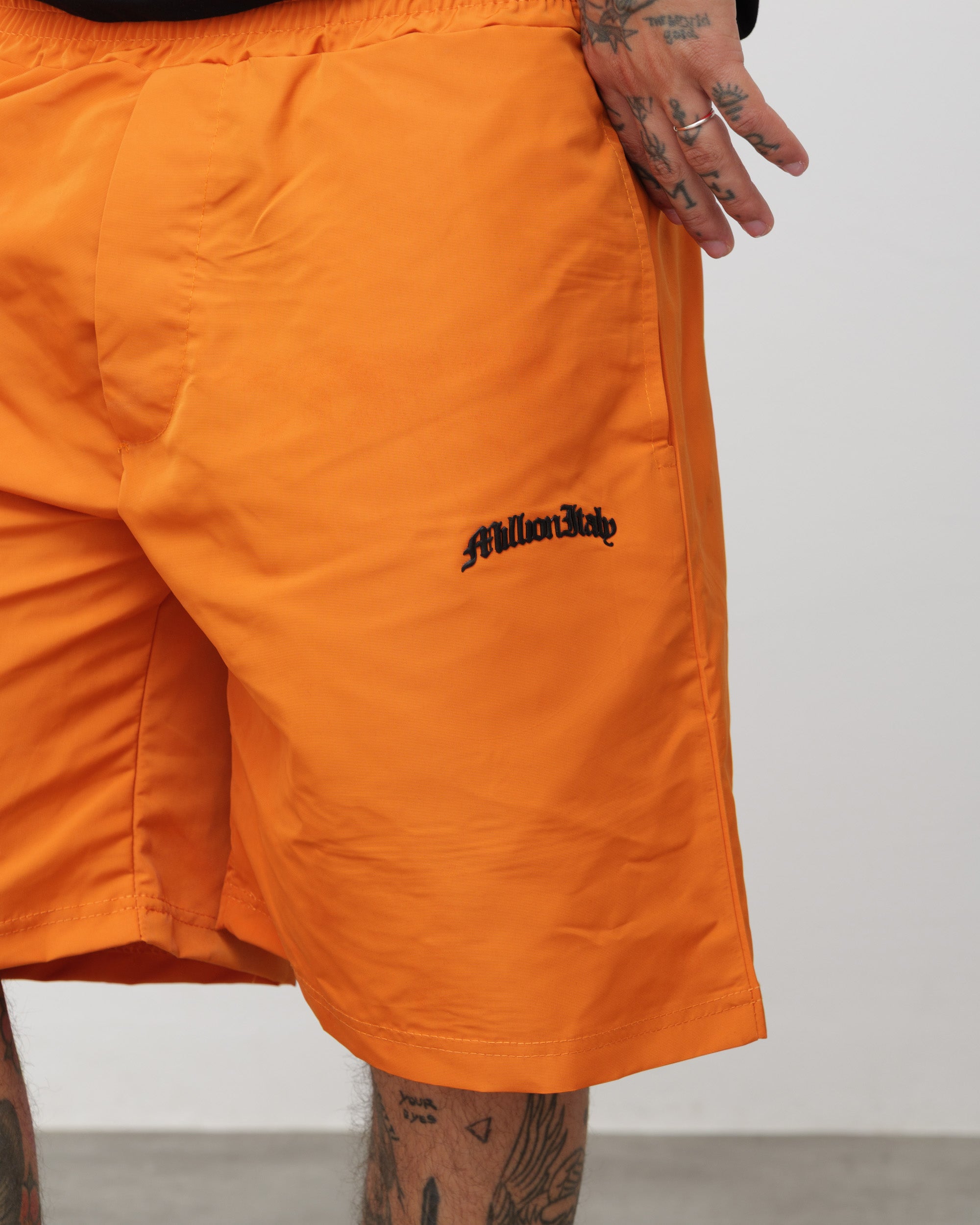 Shorts Tech Arancio - Logo Nero