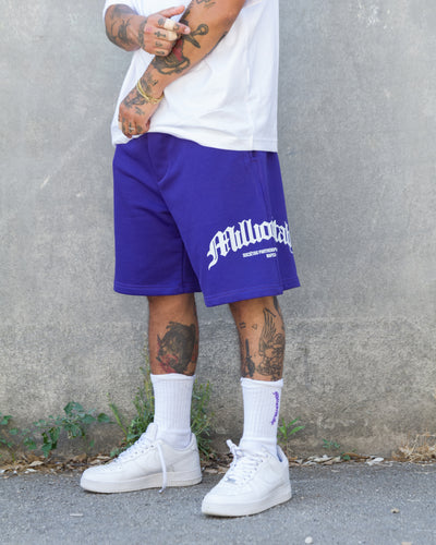 Shorts violet à logo arqué